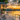 Wooden_deck_with_white_cable_railing_lake_view